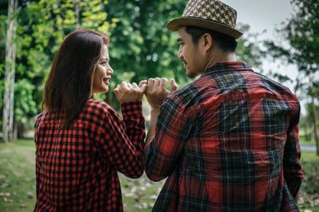 Happy to be together. beautiful young loving couple standing outdoorsの写真素材