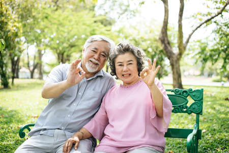 Happy senior couple in the parkの写真素材