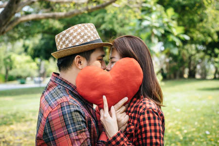 Happy to be together. beautiful young loving couple standing outdoorsの写真素材