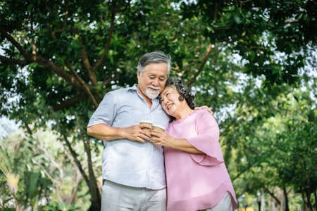Happy senior couple in the parkの写真素材