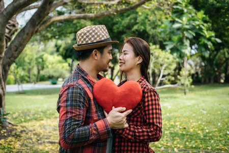 Happy to be together. beautiful young loving couple standing outdoorsの写真素材