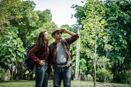 Happy to be together. beautiful young loving couple standing outdoorsの写真素材