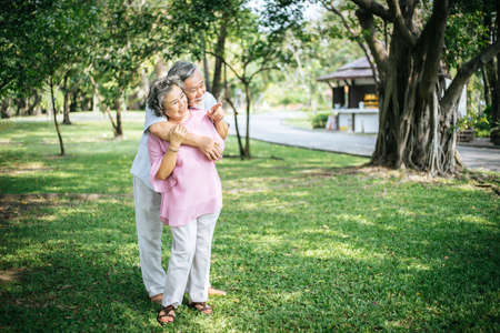 Happy senior couple in the parkの写真素材