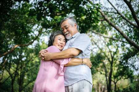 Happy senior couple in the parkの写真素材