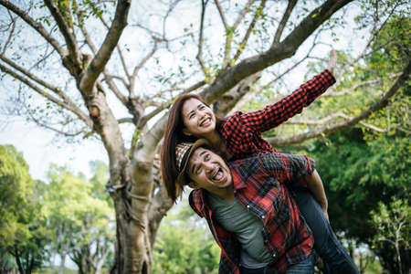 Happy to be together. beautiful young loving couple standing outdoorsの写真素材