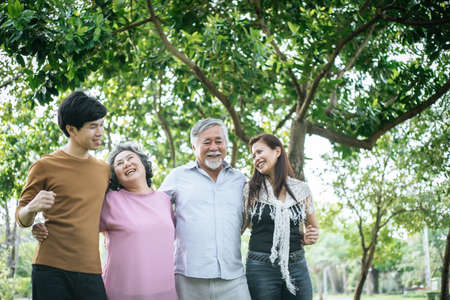 happy  family walking outdoor in the parkの写真素材
