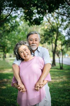 Happy senior couple in the parkの写真素材