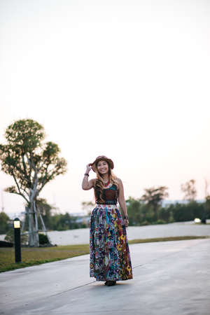 Outdoor portrait of young beautiful happy smiling woman posing on street.の写真素材