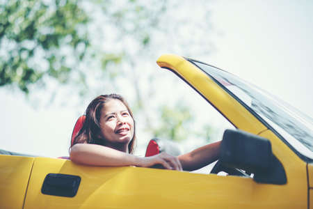 Happy Couple Driving in Convertibleの写真素材
