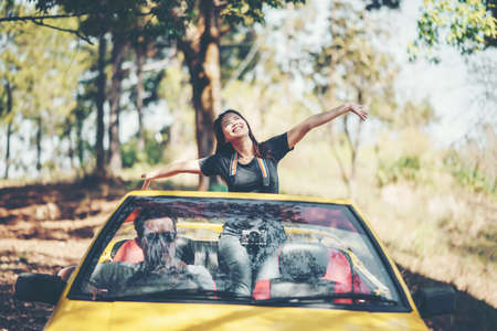 Happy Couple Driving in Convertibleの写真素材