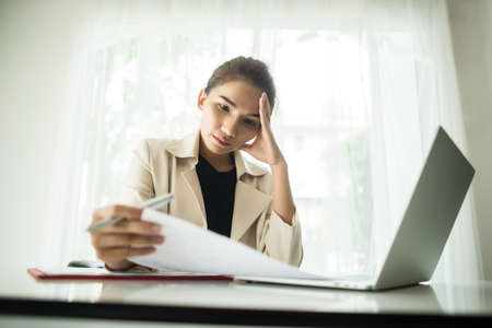 Young business people are suffering from headachesの写真素材