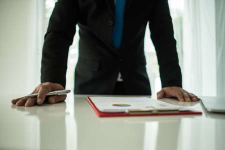 Young businessman working with laptop at officeの写真素材