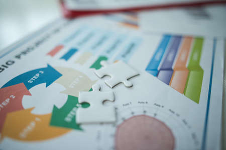 business documents over papers with numbers and charts. View from aboveの写真素材