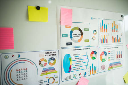 business documents over papers with numbers and charts. View from aboveの写真素材