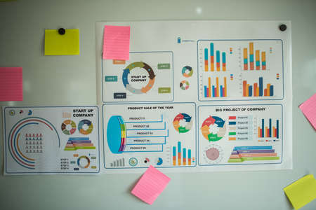 business documents over papers with numbers and charts. View from aboveの写真素材