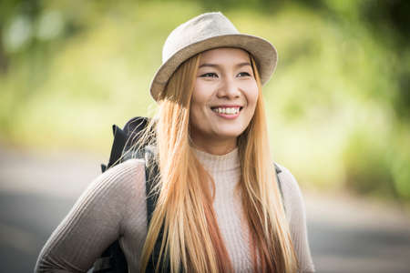 Young attractive woman backpack to traveling on her holiday. Woman lifestyle concept.の写真素材
