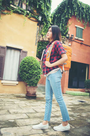 Young asian woman backpacking travel around urban. Woman Lifestyle concept.の写真素材