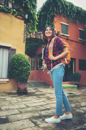 Young asian woman backpacking travel around urban. Woman Lifestyle concept.の写真素材