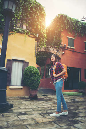 Young asian woman backpacking travel around urban. Woman Lifestyle concept.の写真素材