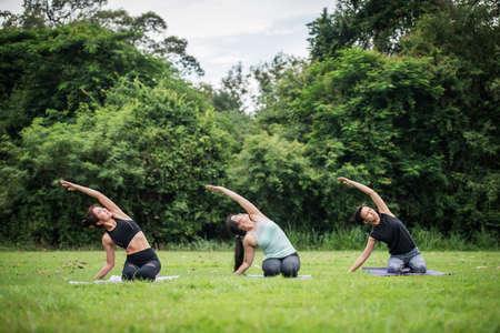 Yoga action exercise healthy in the parkの写真素材