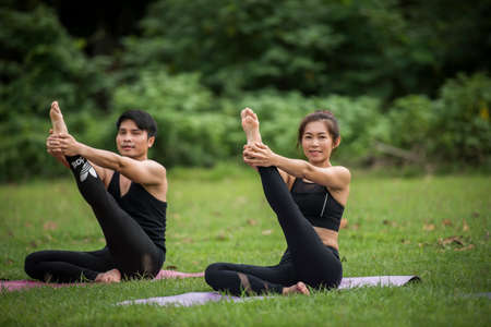 Yoga action exercise healthy in the parkの写真素材