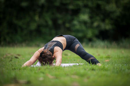 Yoga action exercise healthy in the parkの写真素材