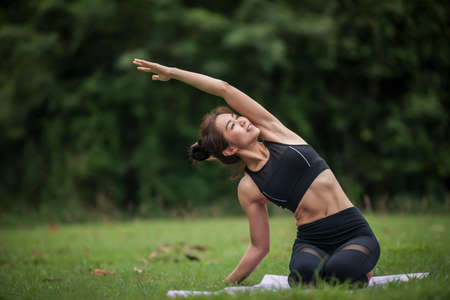 Yoga action exercise healthy in the parkの写真素材