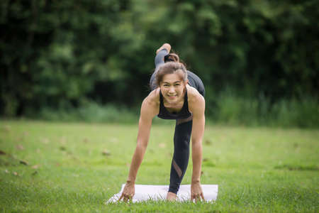 Yoga action exercise healthy in the parkの写真素材