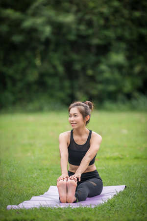 Yoga action exercise healthy in the parkの写真素材