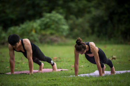 Yoga action exercise healthy in the parkの写真素材