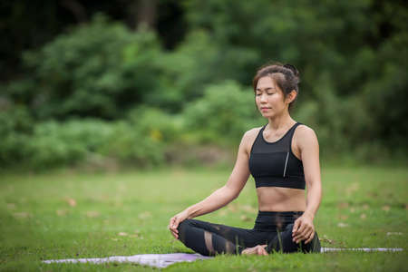 Yoga action exercise healthy in the parkの写真素材