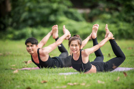 Yoga action exercise healthy in the parkの写真素材