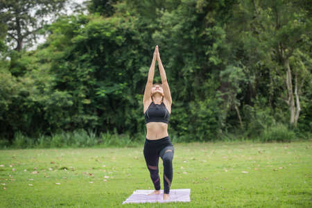 Yoga action exercise healthy in the parkの写真素材