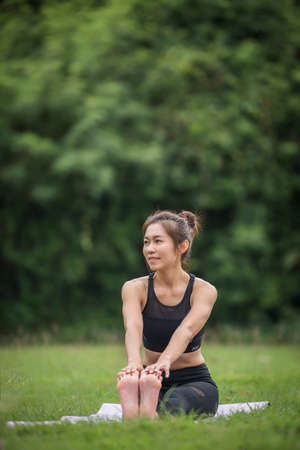 Yoga action exercise healthy in the parkの写真素材
