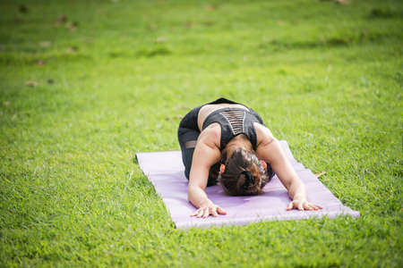 Yoga action exercise healthy in the parkの写真素材