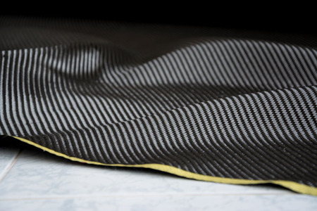 black carbon fiber composite raw material backgroundの写真素材
