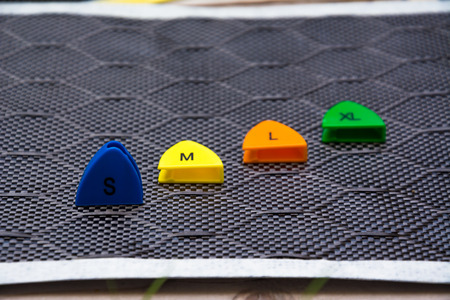 Size number on carbon fiber material background