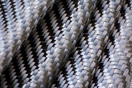 black carbon fiber composite raw material backgroundの写真素材