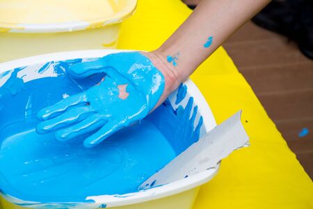 Hand make a trace colorful symbol on white paper backgroundの写真素材