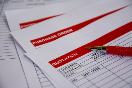 Quotation business document on paper backgroundの写真素材