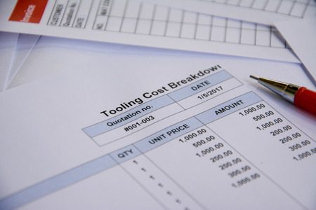 Quotation business document on paper backgroundの写真素材