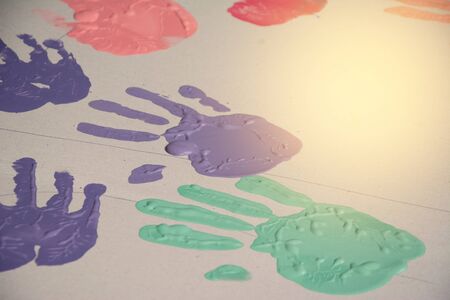 Hand make a trace colorful symbol on white paper backgroundの写真素材