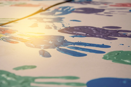 Hand make a trace colorful symbol on white paper backgroundの写真素材