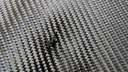Black carbon fiber composite material backgroundの写真素材