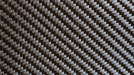 Black carbon fiber composite material backgroundの写真素材