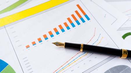 business report with pen statement with graph and data analysisの写真素材