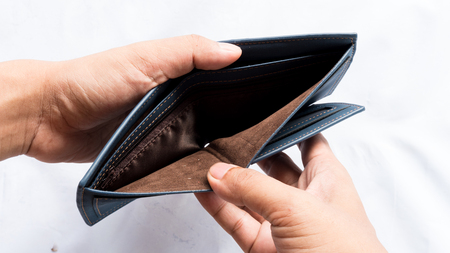 Wallet empty and no money hold in his handの写真素材