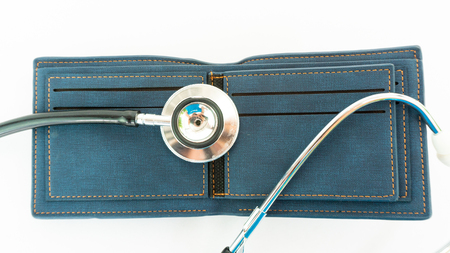 stethoscope check money on empty wallet bagの写真素材