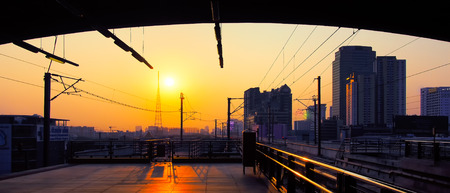 Sunrise at Electric Railway Station with Cityscape in Central Urban, Airport Rail Link in Bangkok,...