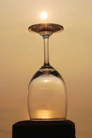 sunset on wine glassの写真素材